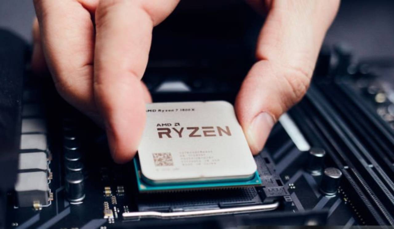 AMD Ryzen 1800X CPU being installed in PC motherboard